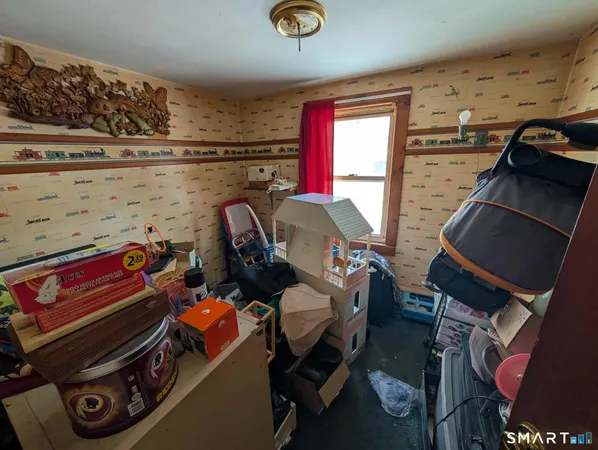a bedroom with a bed and a mirror