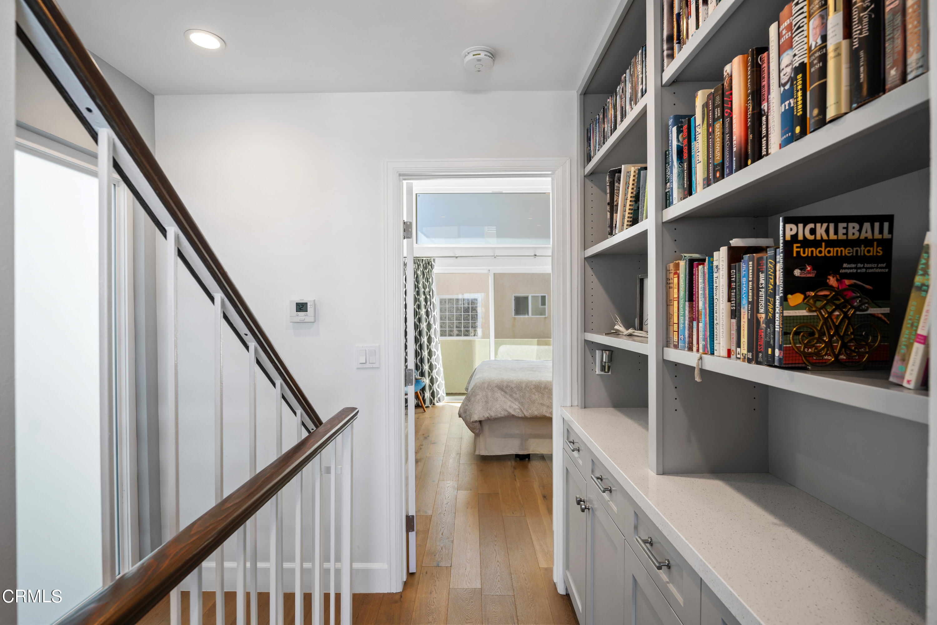 3545 Sunset Lane Oxnard, CA 93035 - Photo 19 of 41 a view of hallway with stairs and wooden floor