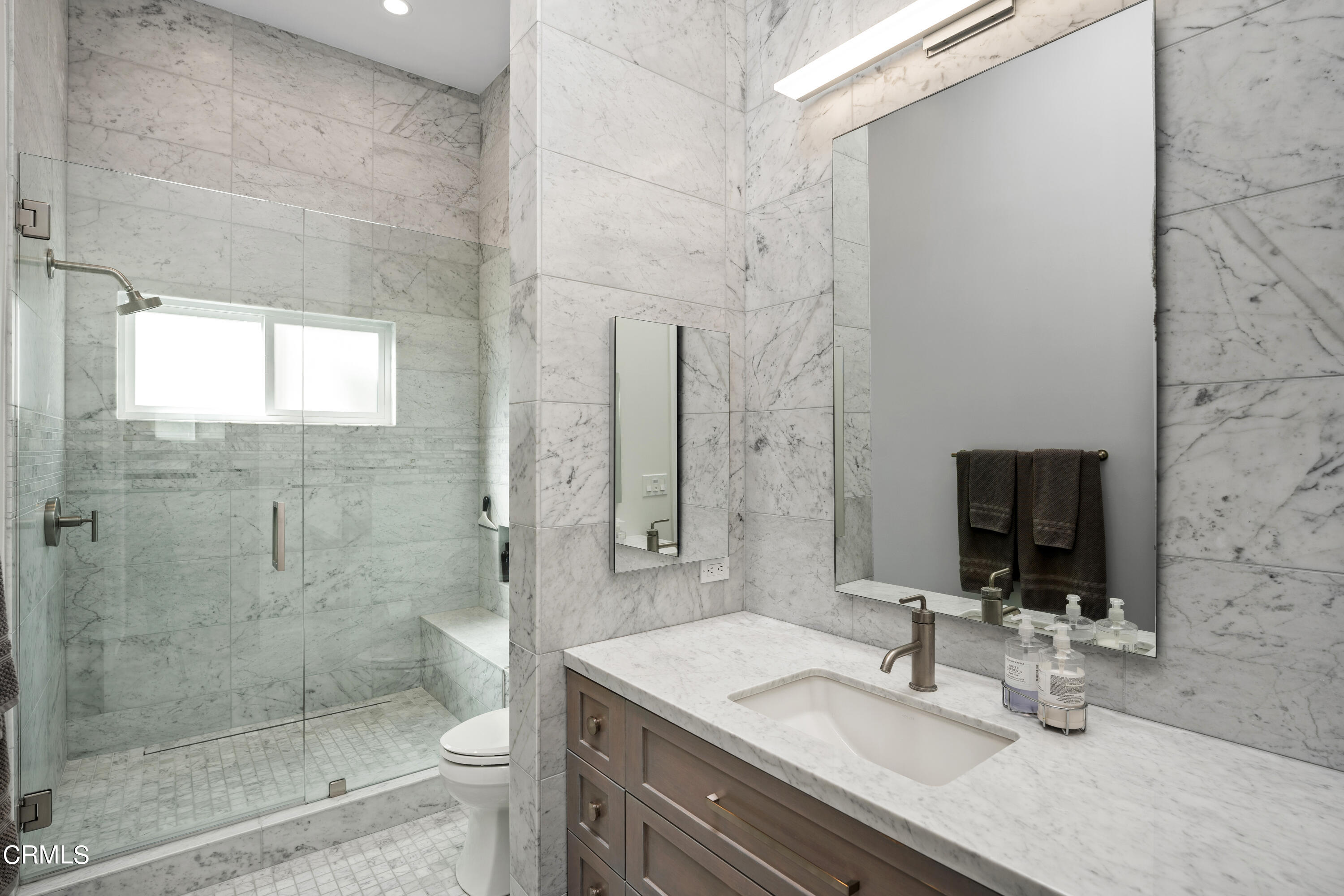 3545 Sunset Lane Oxnard, CA 93035 - Photo 23 of 41 a bathroom with a granite countertop sink a mirror and a shower