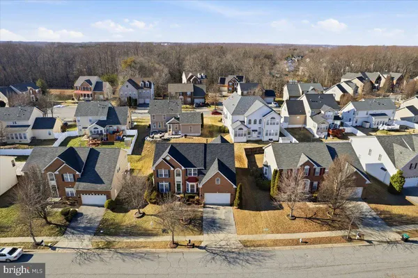 a aerial view of a house with large trees