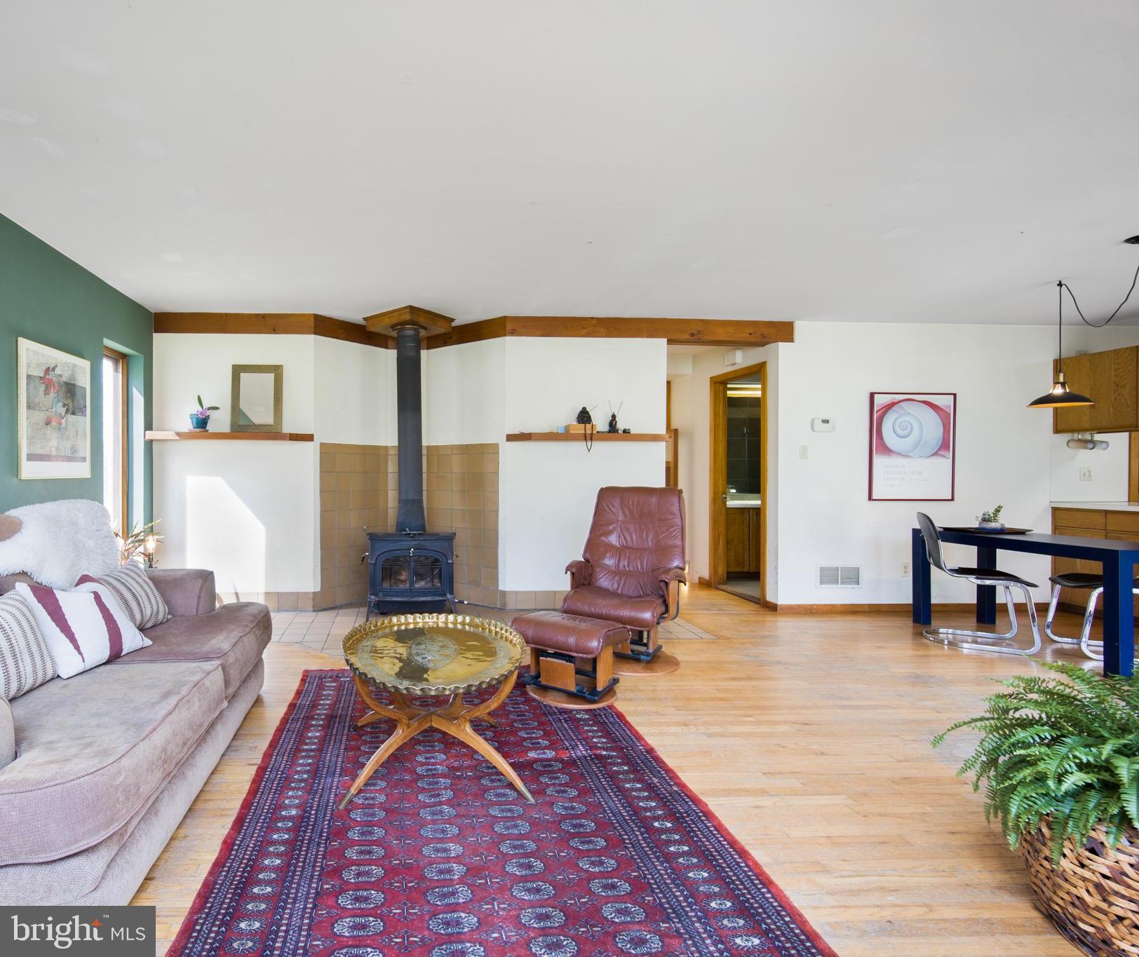 1749 Pickering Road Phoenixville, PA 19460 - Photo 12 of 28 LR with woodstove, hall to main level bath and bed