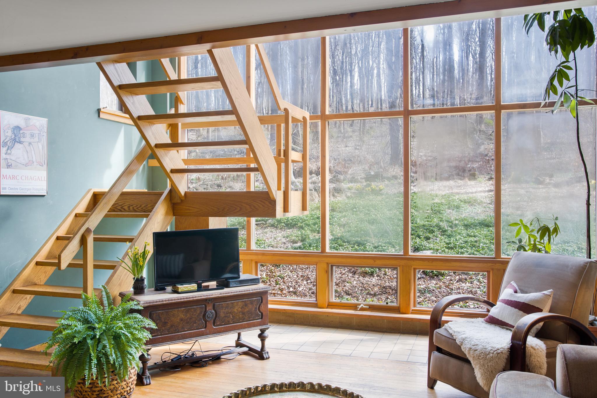 1749 Pickering Road Phoenixville, PA 19460 - Photo 4 of 28 Wall of windows facing private wooded vista