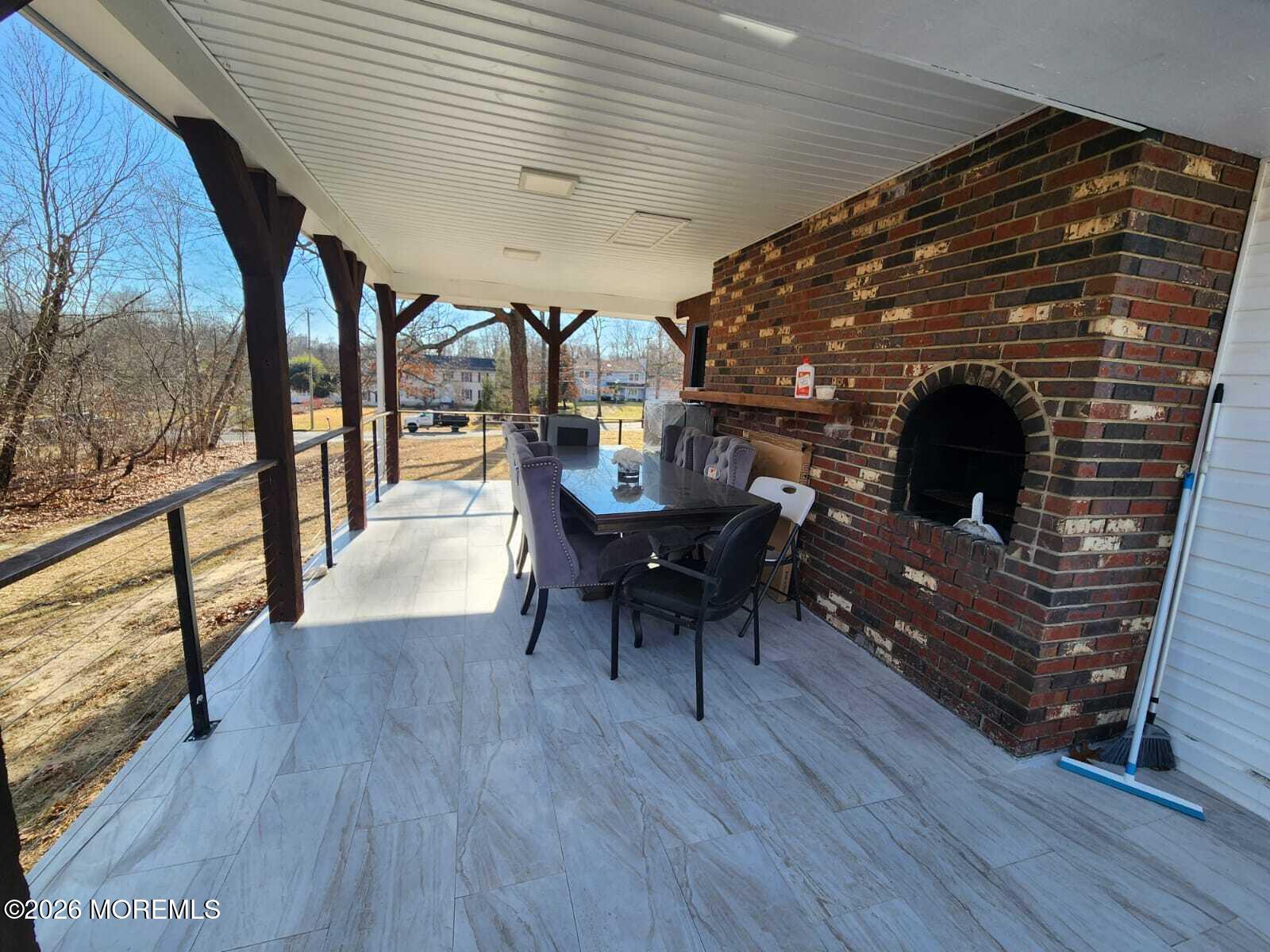 1120 Farmingdale Road Jackson, NJ 08527 - Photo 7 of 8 a dining room with furniture and wooden floor