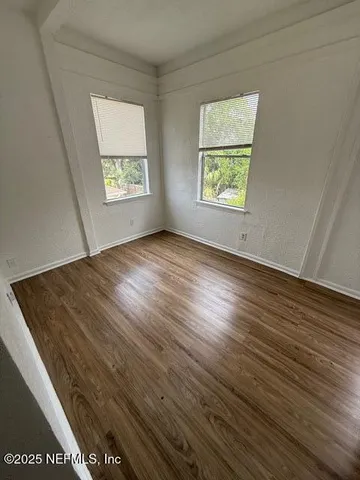 an empty room with windows