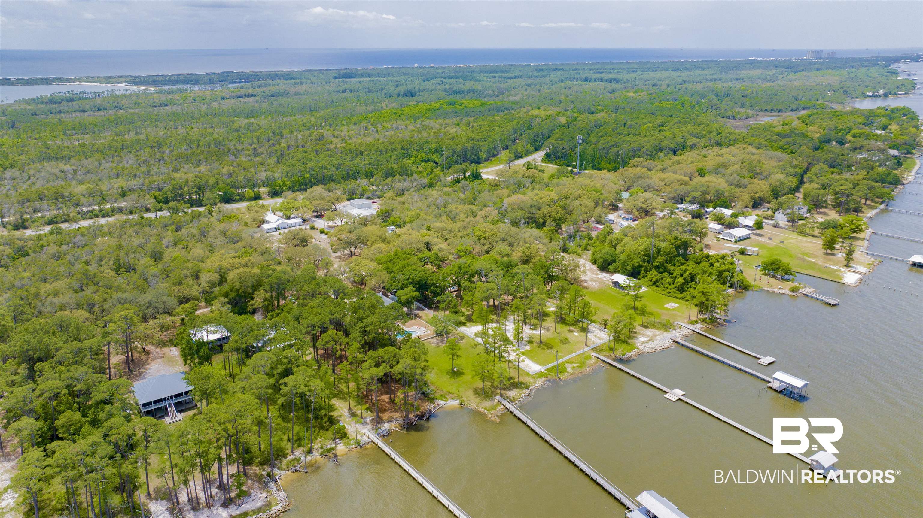 12171 Strong Road Gulf Shores, AL 36542 - Photo 14 of 27 Aerial view with a water view and a view of trees