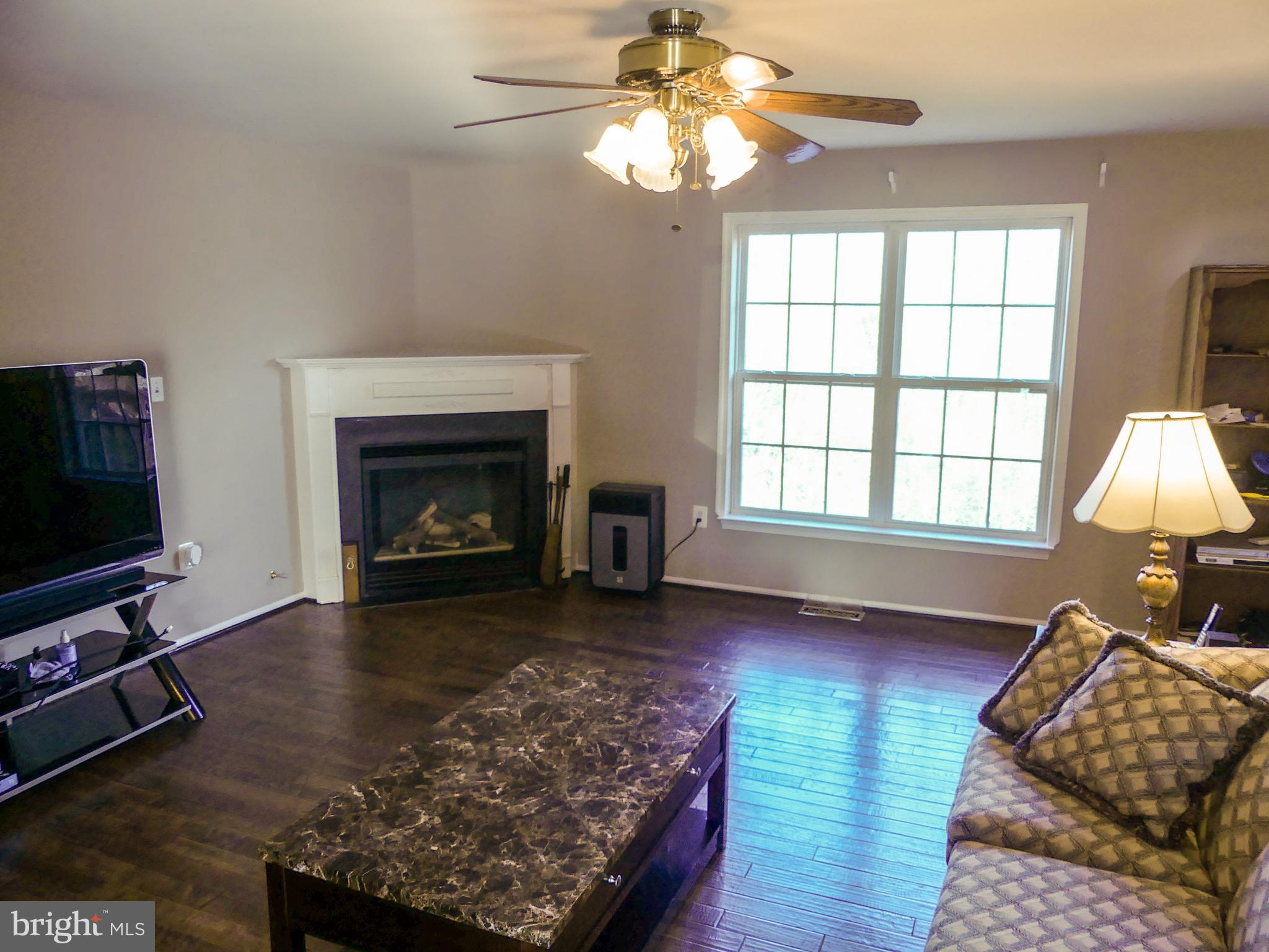 28 Ripley Road Stafford, VA 22556 - Photo 6 of 29 Family room with gas log and tree views.