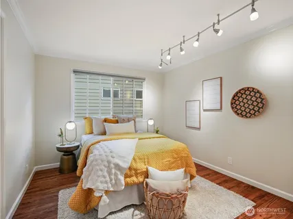 a bedroom with a bed and a table in it