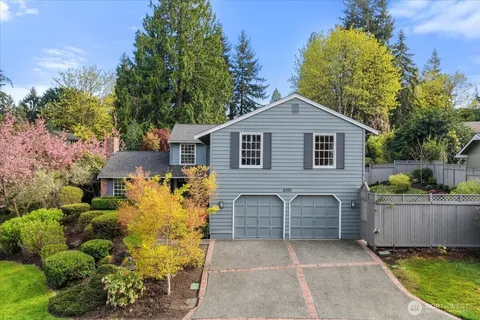 a view of a house with a backyard and a garden