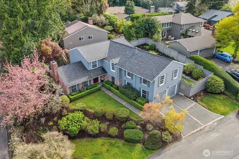 an aerial view of a house with swimming pool outdoor seating and yard
