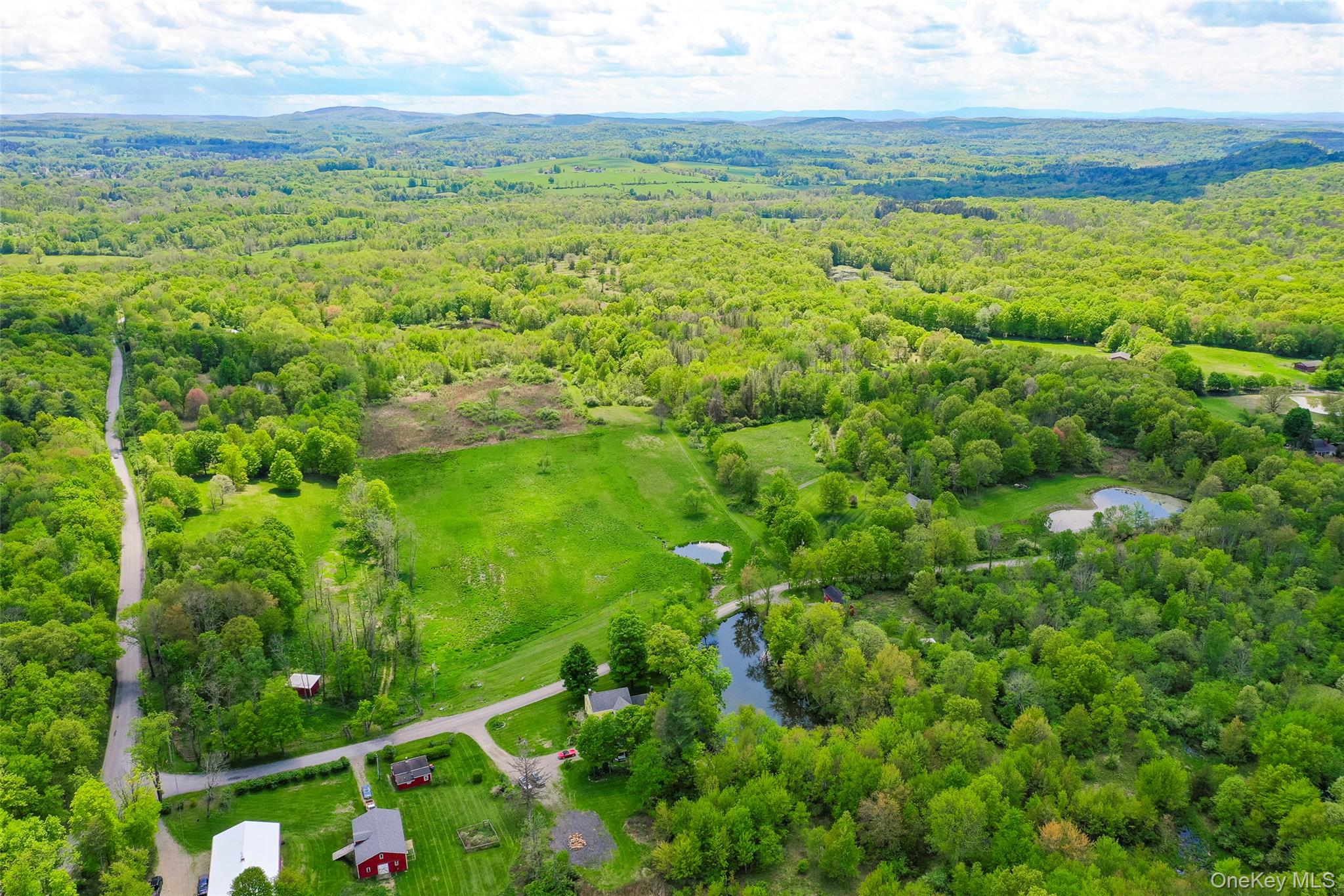 521 Woodstock Road Millbrook, NY 12545 - Photo 3 of 9 a view of an outdoor space with a lake view