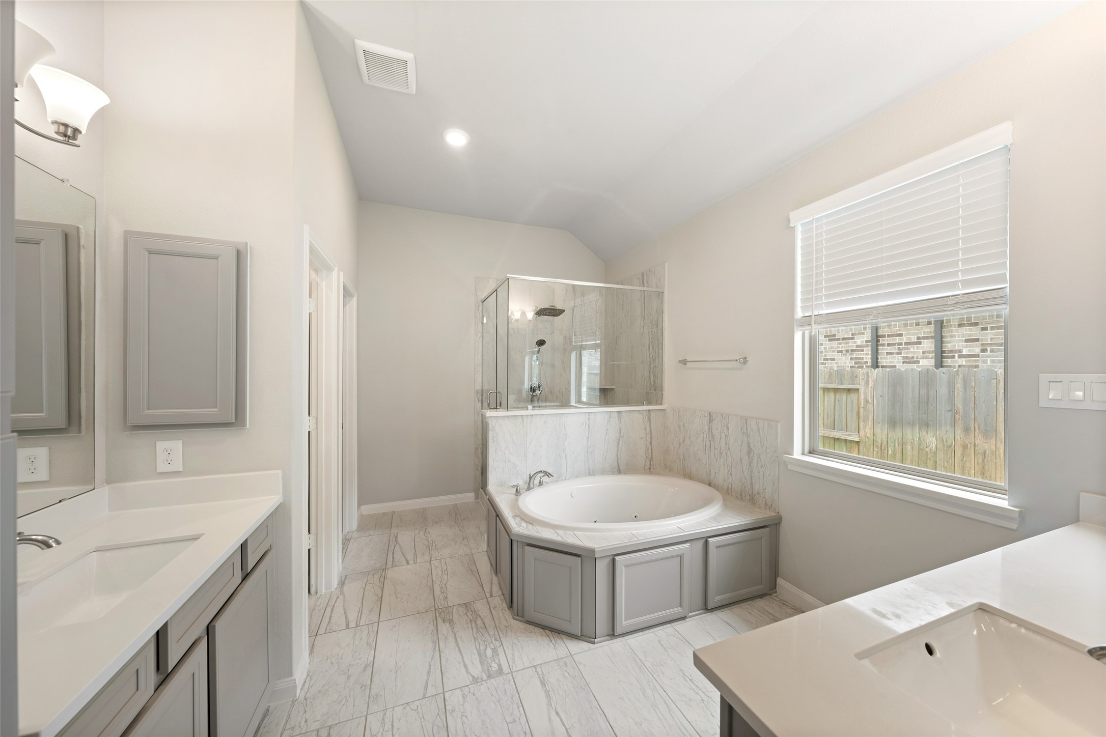17323 Grand Canyon Road Conroe, TX 77302 - Photo 16 of 33 Spa-inspired just seems so right! Jetted tub, garden window, glass-walled shower and elegant tile.