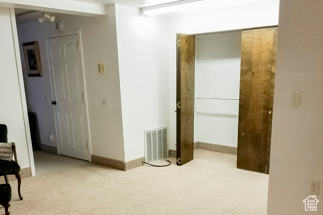 2855 South 1000 West Perry, UT 84302 - Photo 31 of 142 Empty room featuring light colored carpet and baseboards