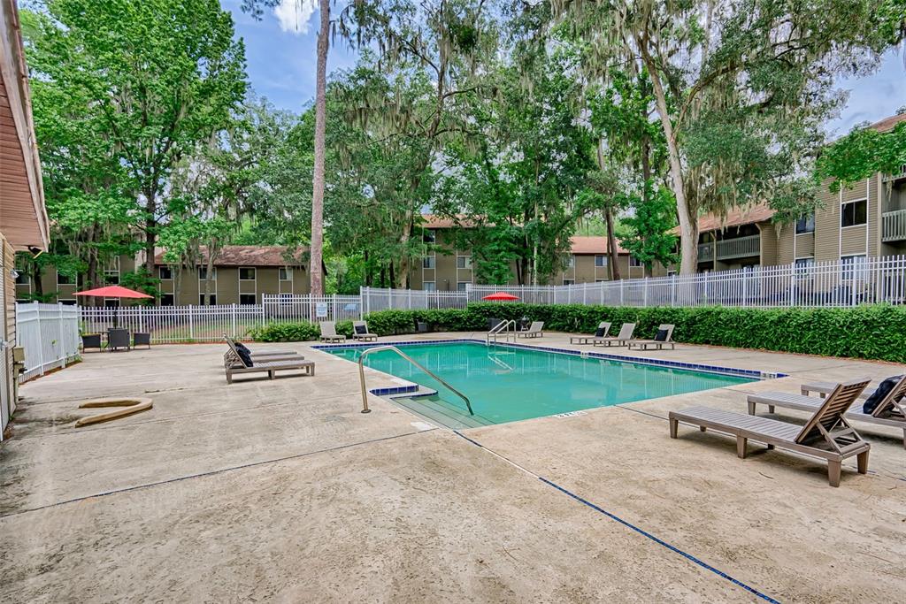 75 Southeast 16th Avenue, Unit A101 Gainesville, FL 32601 - Photo 24 of 24 a view of backyard with outdoor seating and green space