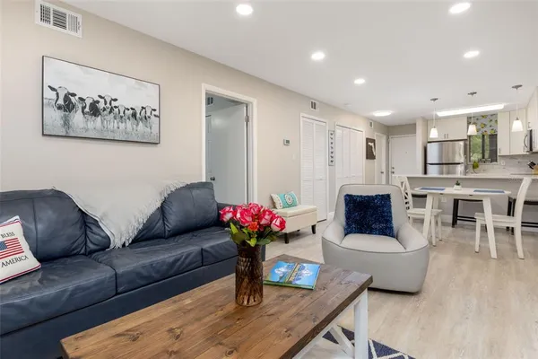 a living room with furniture and a table