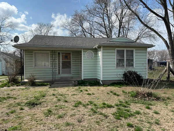 a view of house with yard