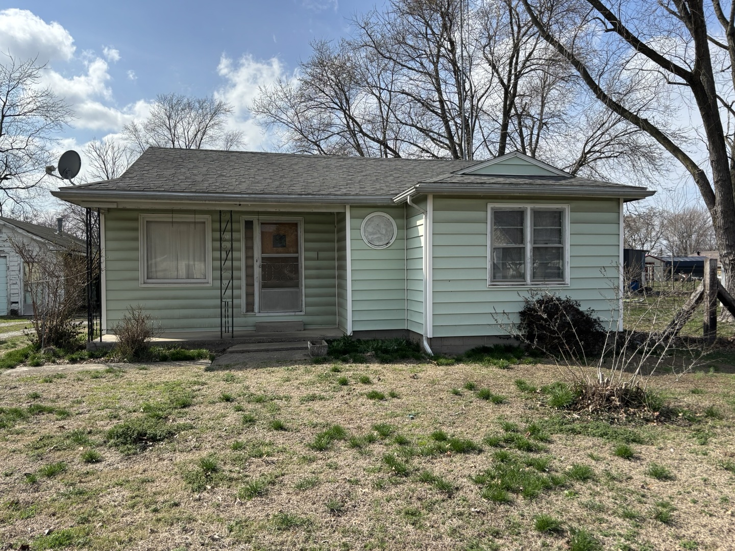 a view of house with yard