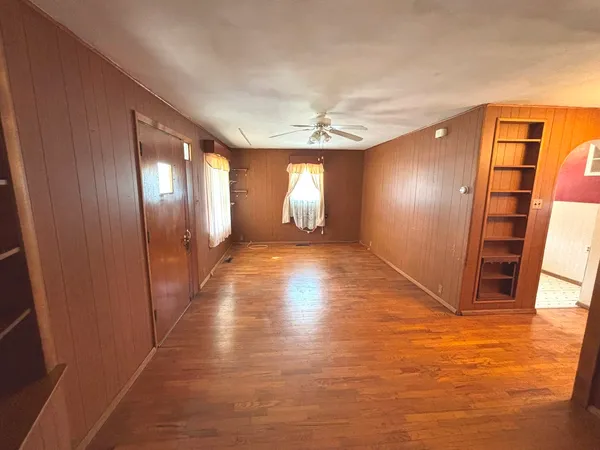 a view of a hallway with windows