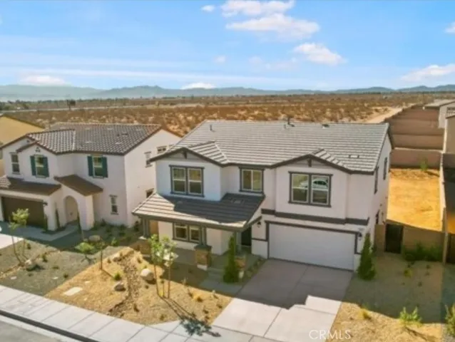 a front view of a house with a ocean view