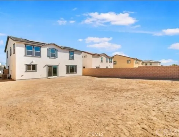 a view of white house with a yard