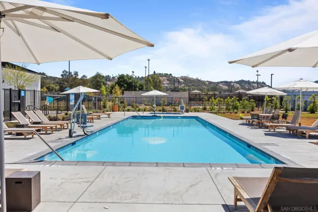 a view of a swimming pool with sitting area
