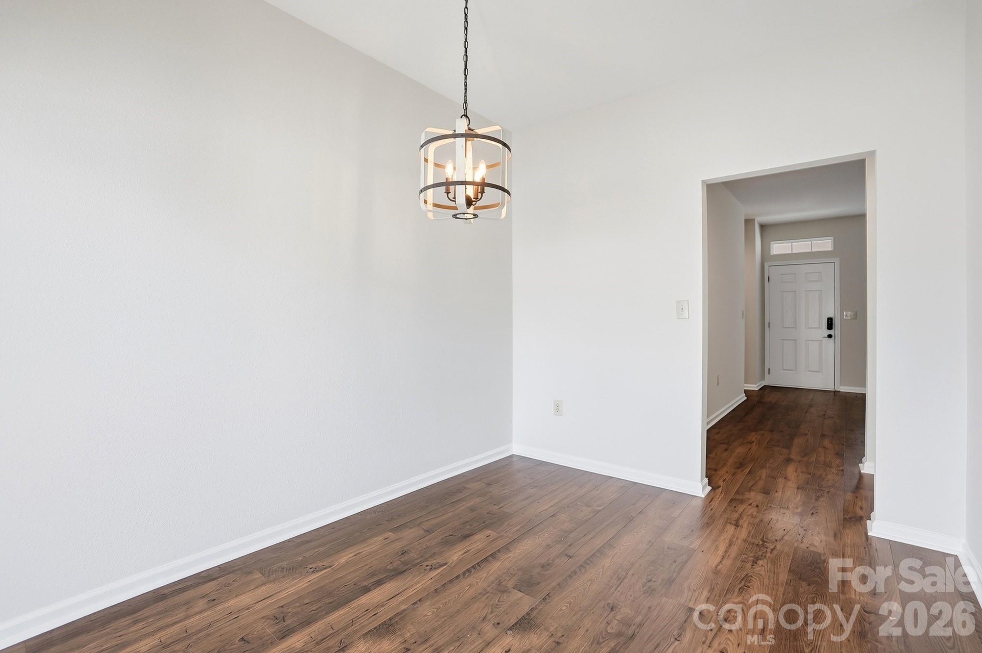711 Stone Village Drive Fort Mill, SC 29708 - Photo 15 of 46 a view of a room with wooden floor and ceiling fan
