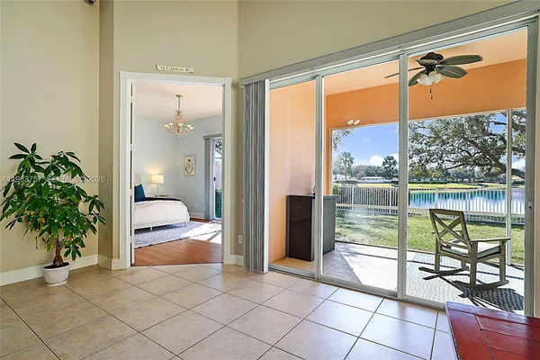 a view of a balcony with wooden floor and door