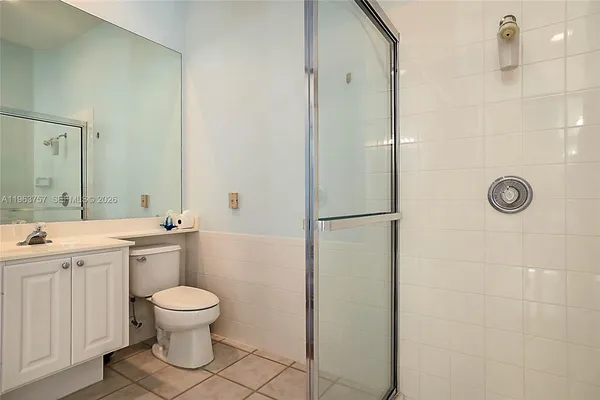 a bathroom with a toilet sink and shower