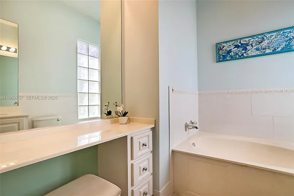 a bathroom with a sink and a bathtub