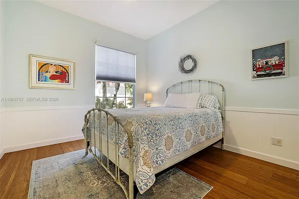 a bedroom with a bed and a table in it