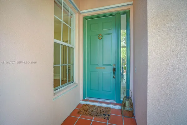 a view of front door with yard