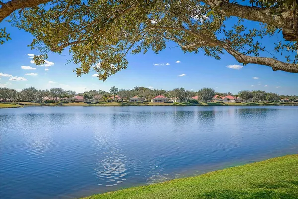 a view of a lake with swimming pool and lake view