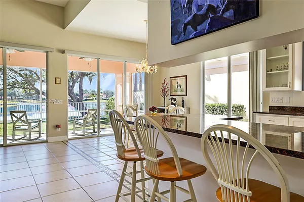 a view of a dining room with furniture water view and balcony
