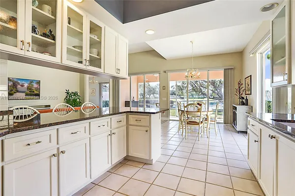 a kitchen with stainless steel appliances a sink and cabinets