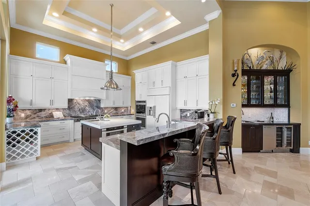 a spacious bathroom with a granite countertop sink a large mirror and shower