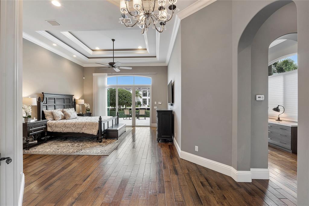 3430 Northeast 23rd Avenue Lighthouse Point, FL 33064 - Photo 13 of 44 a living room with furniture and a chandelier