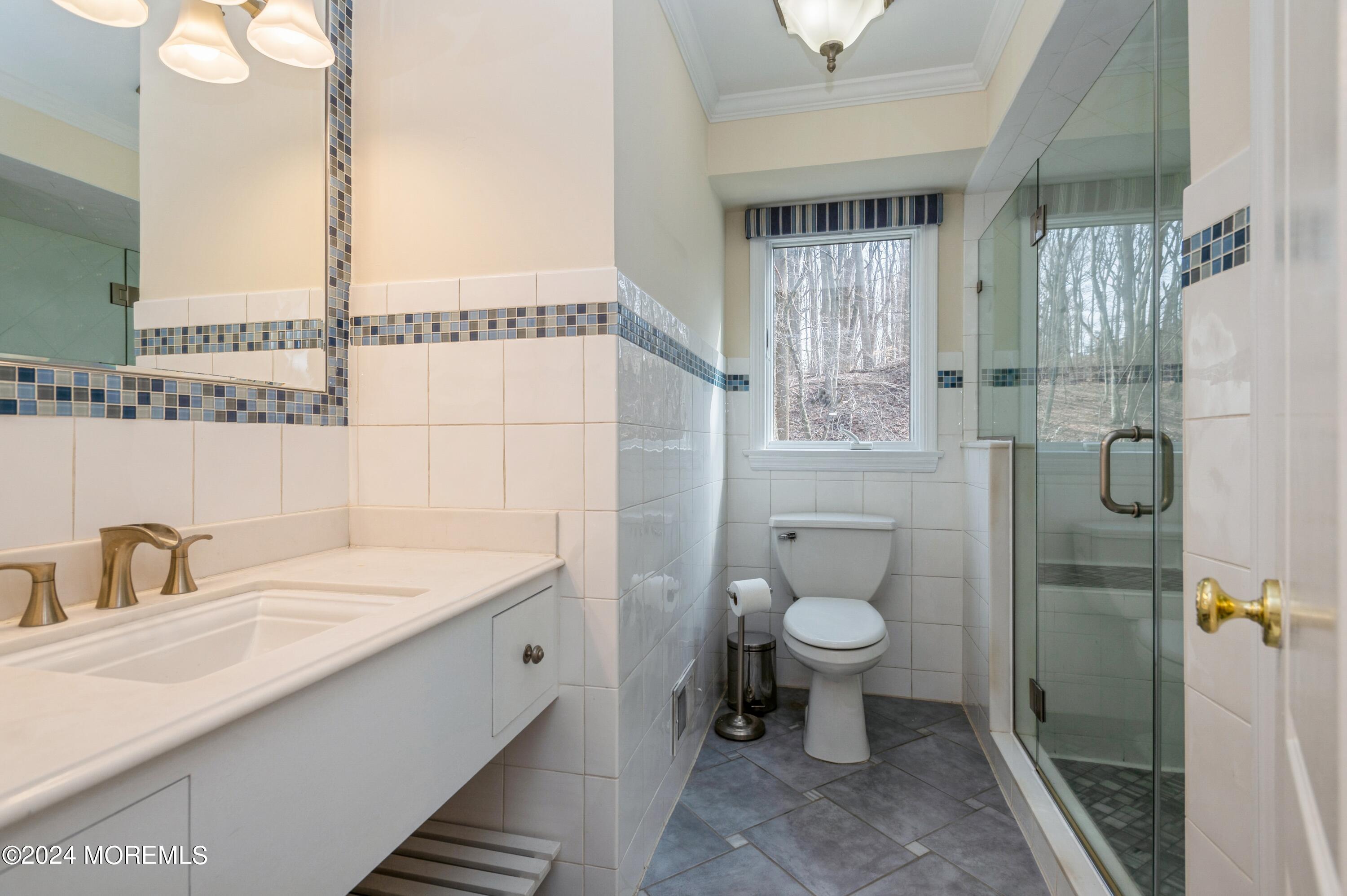 26 Van Brackle Road Holmdel, NJ 07733 - Photo 13 of 36 a bathroom with a sink toilet and shower