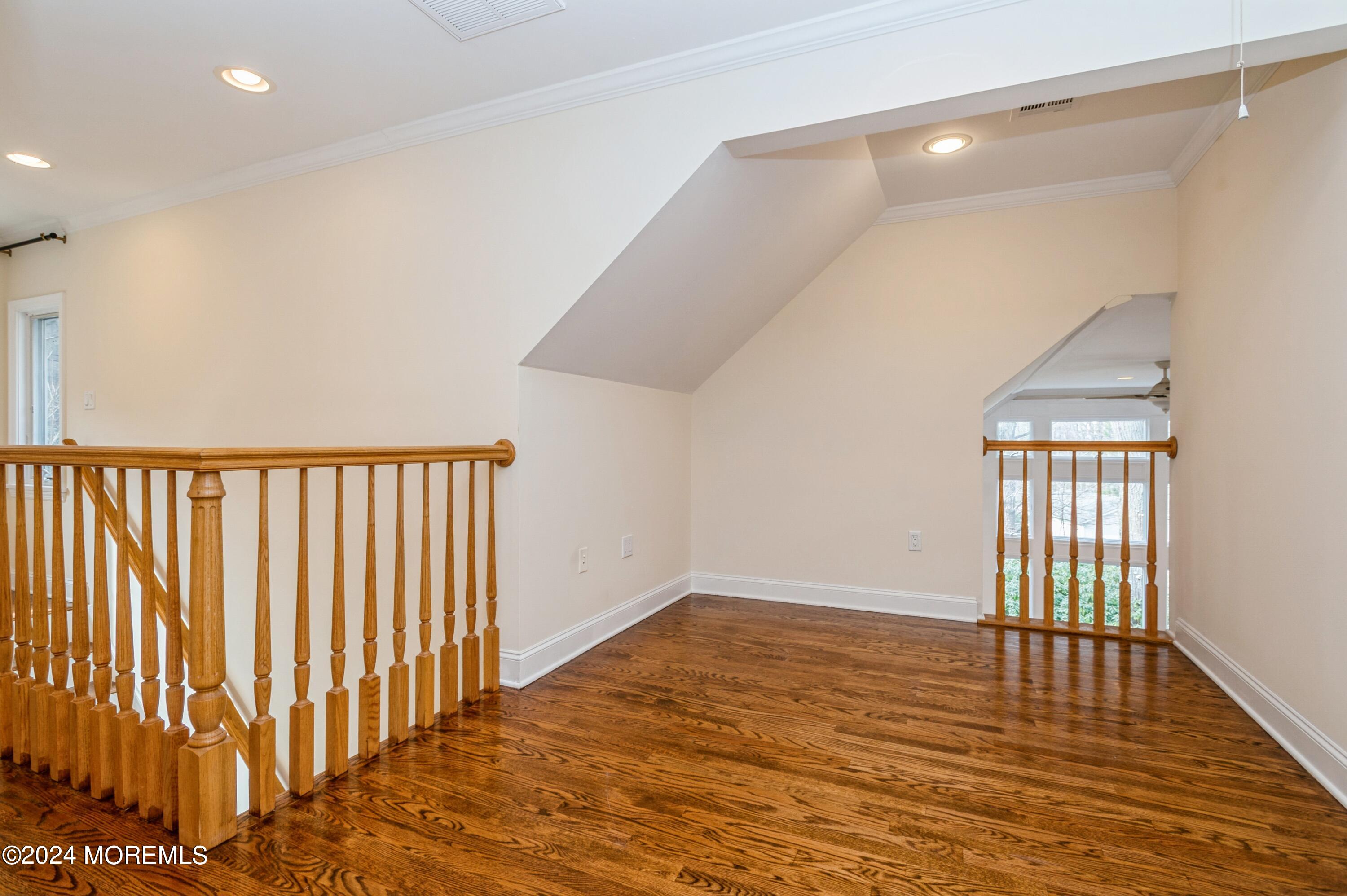26 Van Brackle Road Holmdel, NJ 07733 - Photo 18 of 36 wooden floor in an empty room with a window