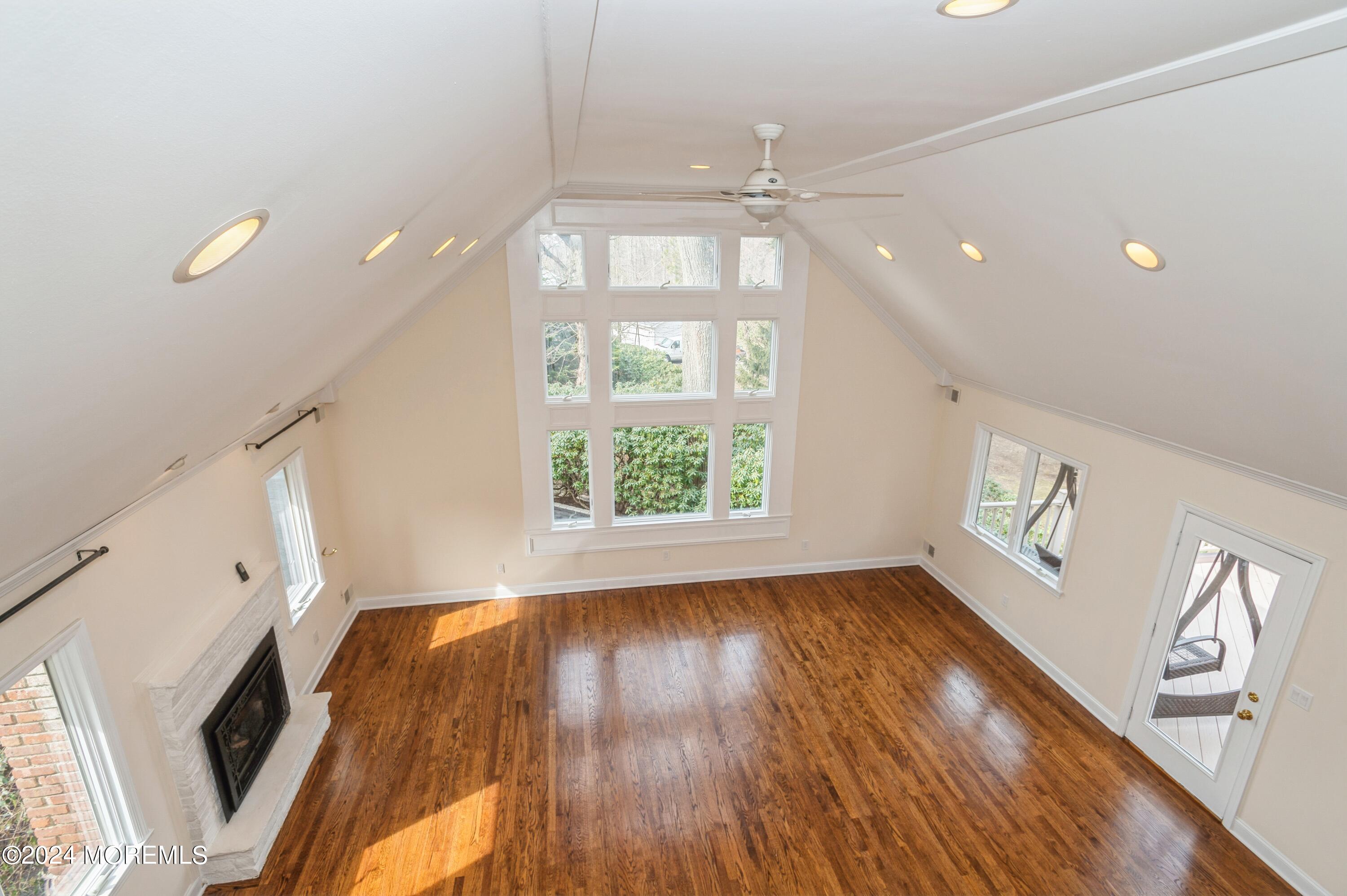 26 Van Brackle Road Holmdel, NJ 07733 - Photo 20 of 36 a view of an empty room with wooden floor and a window