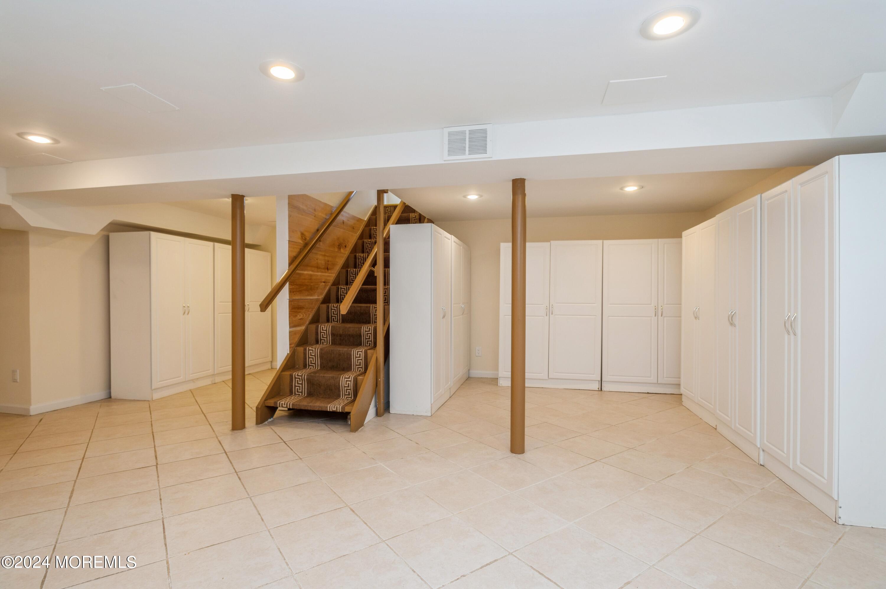 26 Van Brackle Road Holmdel, NJ 07733 - Photo 25 of 36 a view of an empty room with stairs