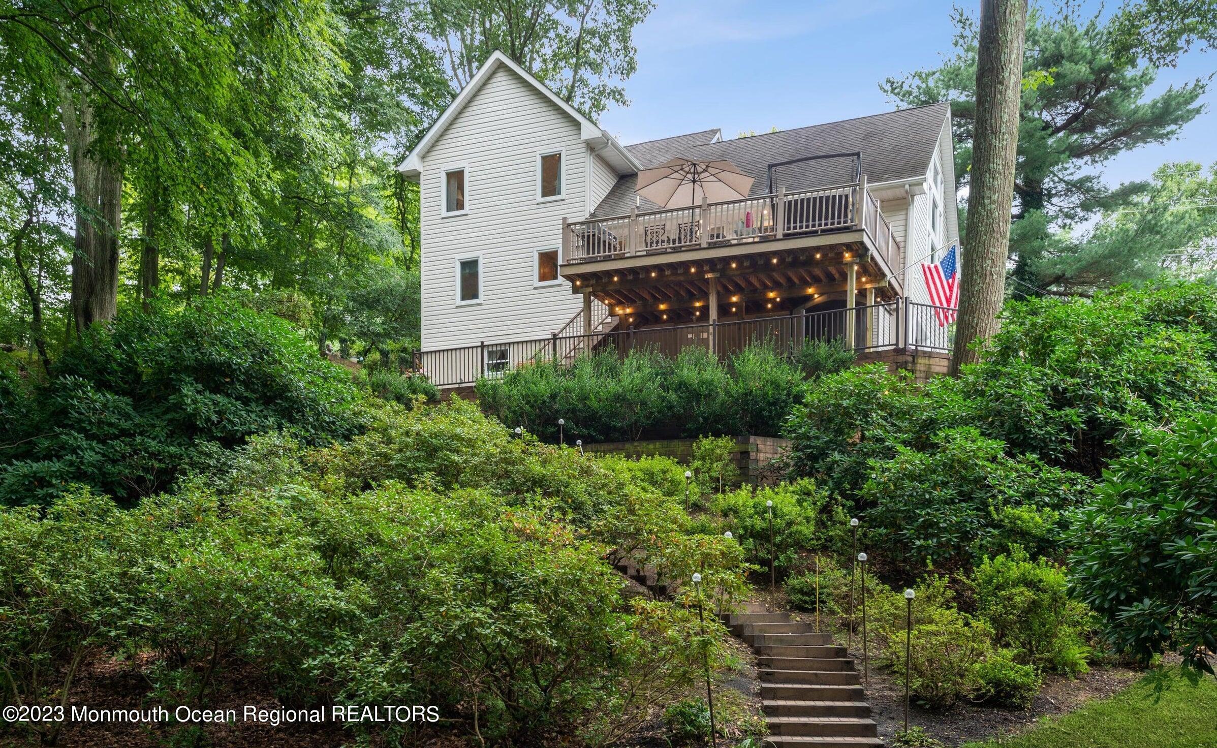 26 Van Brackle Road Holmdel, NJ 07733 - Photo 33 of 36 a view of a back yard of the house