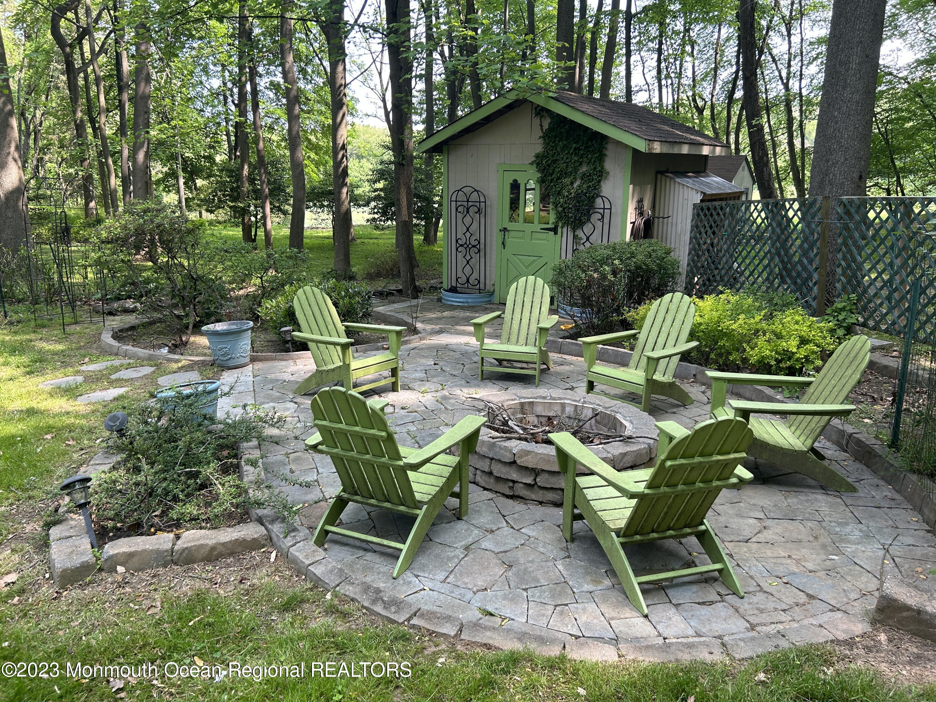26 Van Brackle Road Holmdel, NJ 07733 - Photo 35 of 36 a view of a house with backyard and sitting area