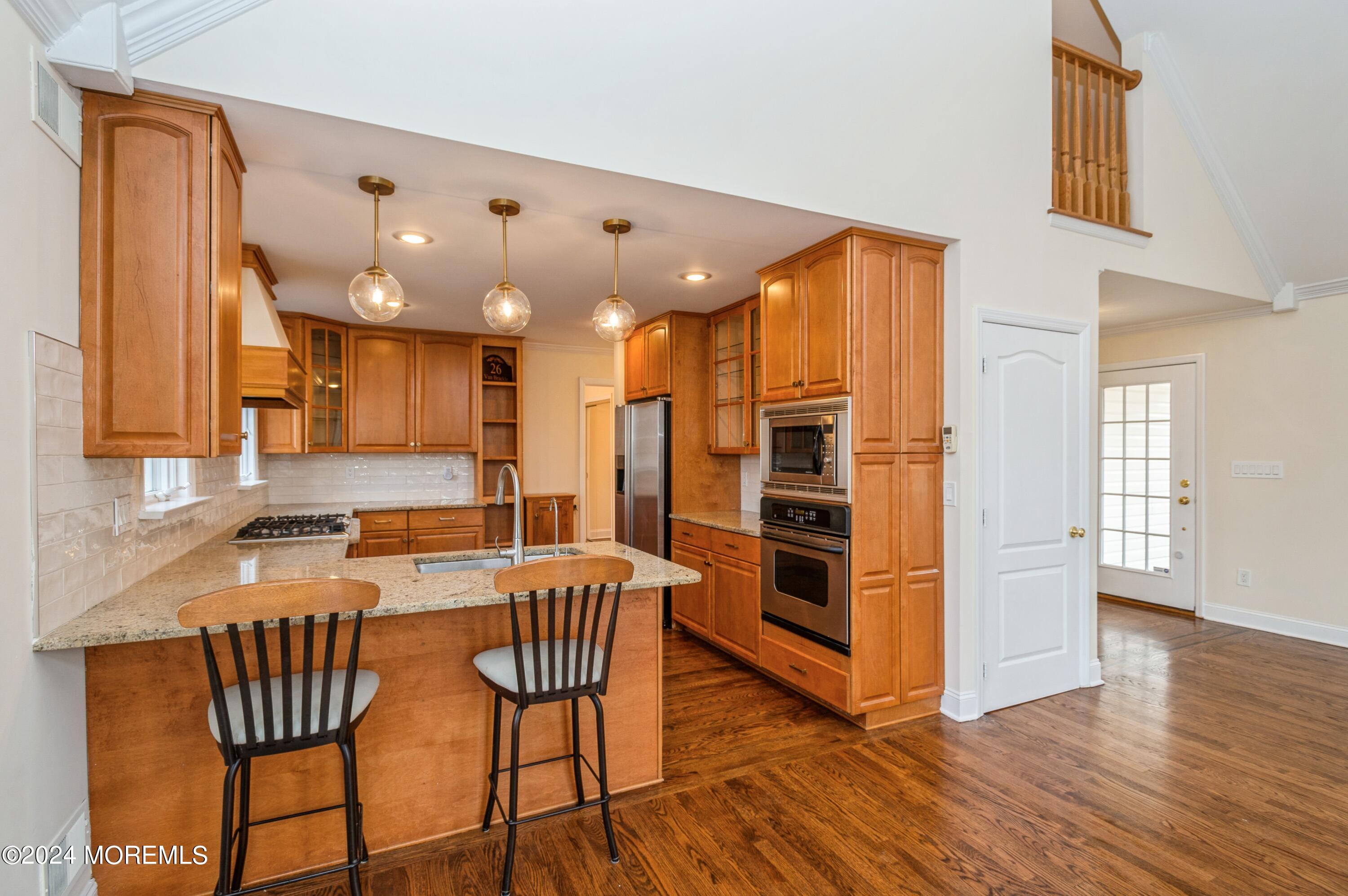 26 Van Brackle Road Holmdel, NJ 07733 - Photo 8 of 36 a view of a kitchen and dining room