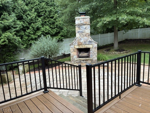 303 Somerset Road Akron, OH 44313 - Photo 24 of 29 The new deck showcases the stone fireplace in the backyard.