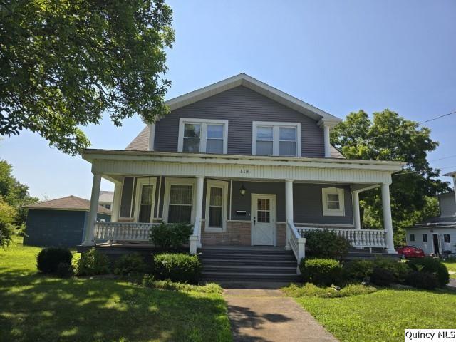 118 South Fayette Street Carthage, IL 62321 - Photo 28 of 32 a front view of a house with a yard