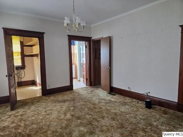 an empty room with chandelier