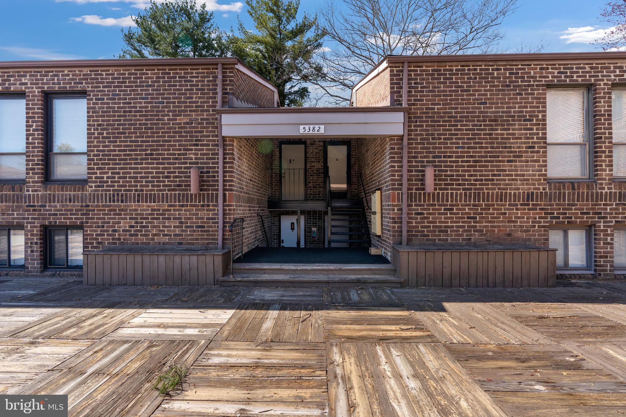 a front view of a house with stairs