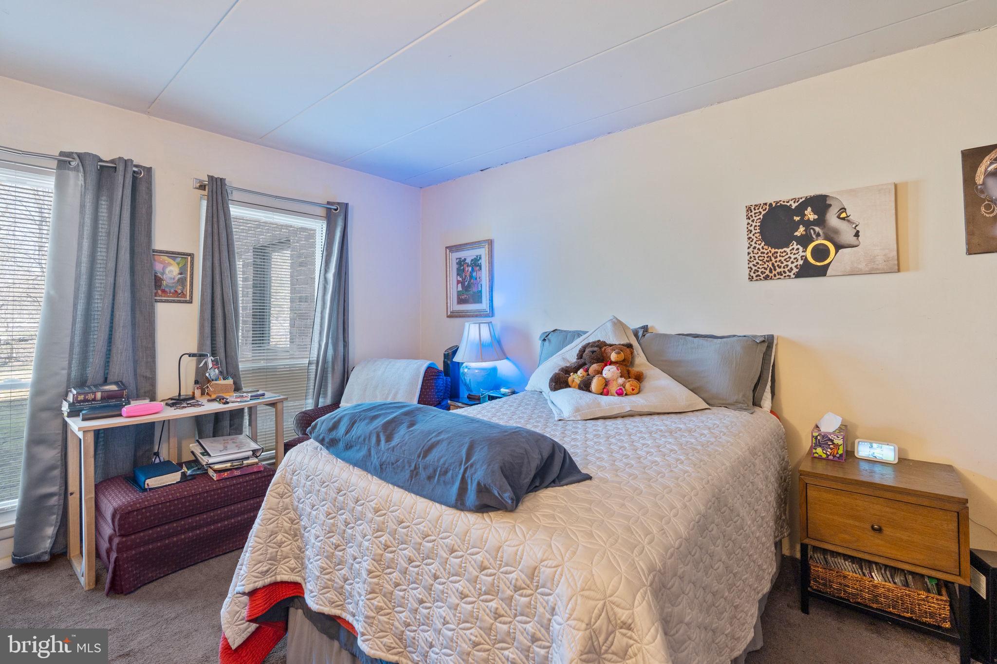 5382 Smooth Meadow Way, Unit 4 Columbia, MD 21044 - Photo 14 of 23 a bedroom with bed and a window