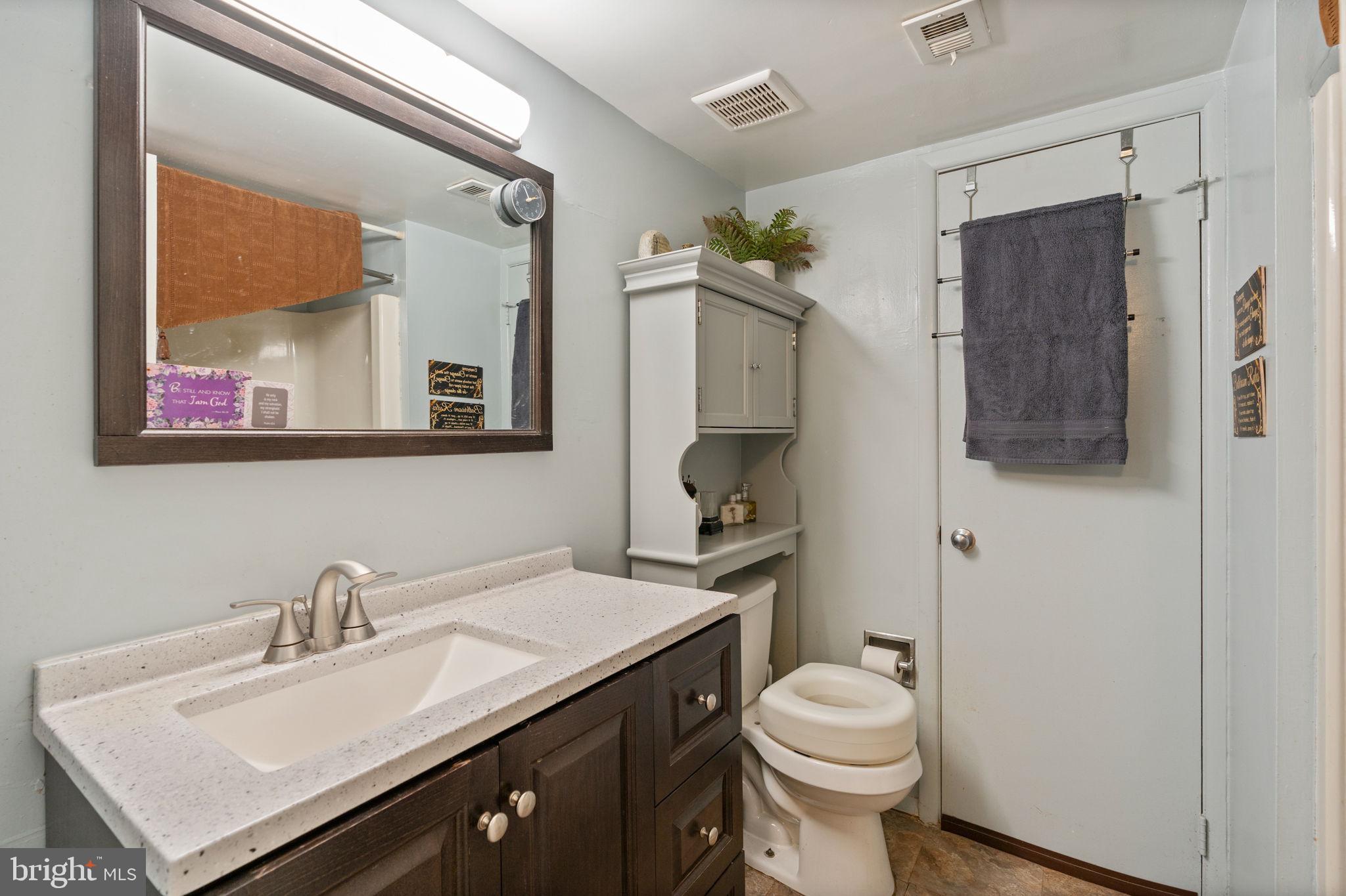 5382 Smooth Meadow Way, Unit 4 Columbia, MD 21044 - Photo 17 of 23 a bathroom with a sink toilet and mirror