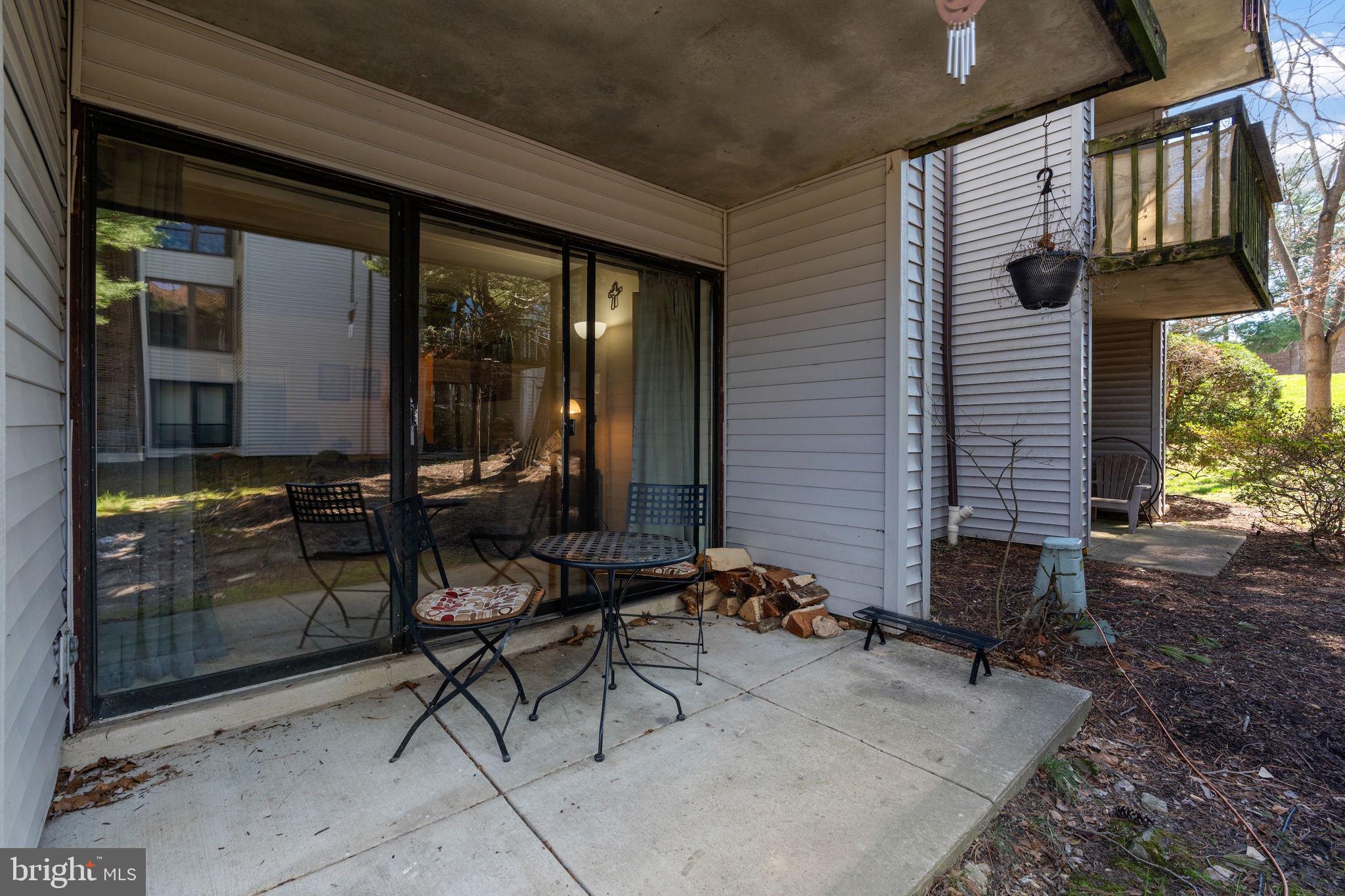 5382 Smooth Meadow Way, Unit 4 Columbia, MD 21044 - Photo 18 of 23 a backyard of a house with outdoor seating