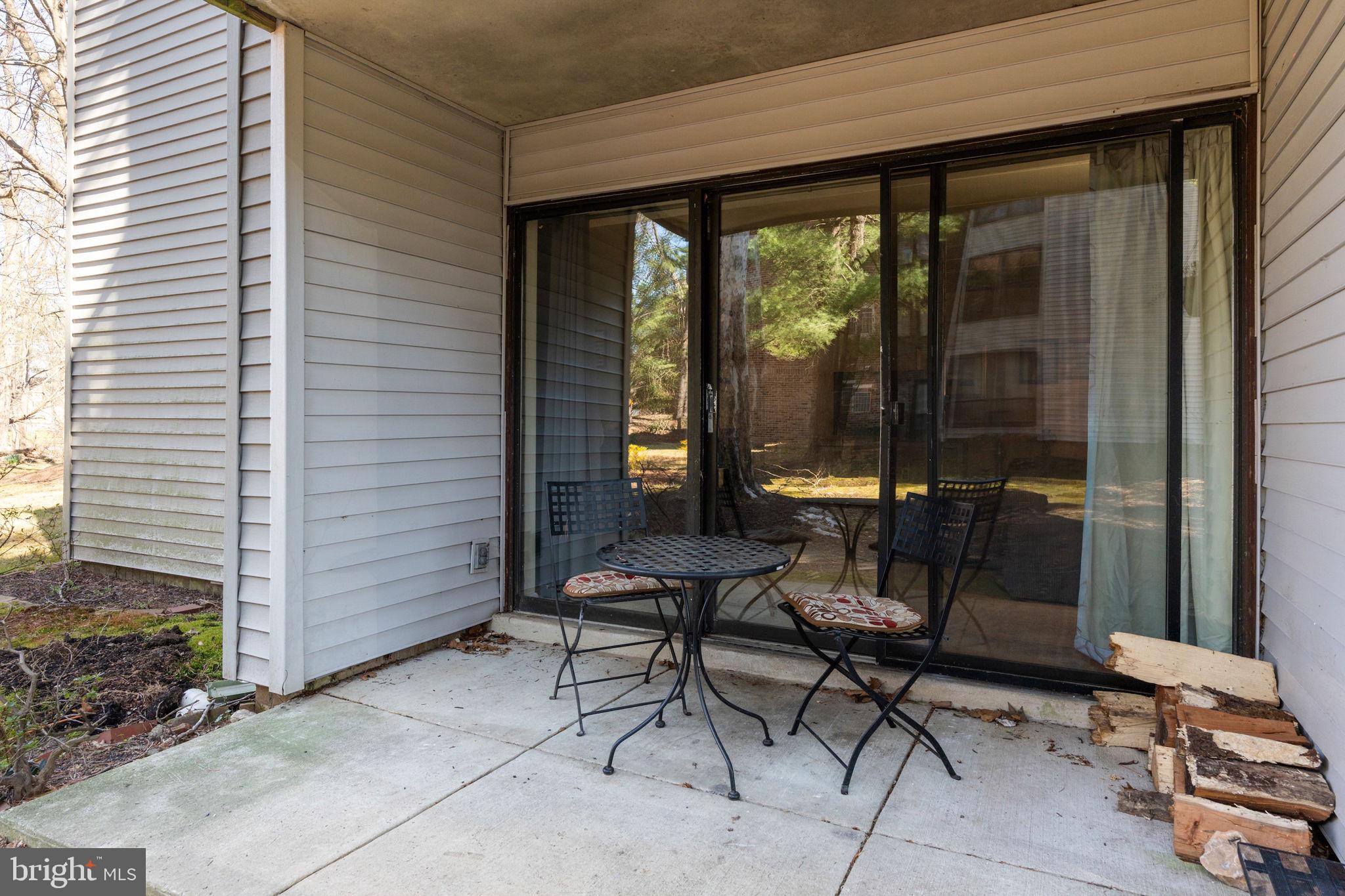 5382 Smooth Meadow Way, Unit 4 Columbia, MD 21044 - Photo 19 of 23 a building outdoor space with patio furniture and potted plants